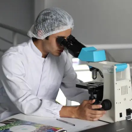 Man looking through a microscope